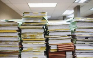 4 large stacks of files